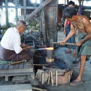 sculptor molding the iron